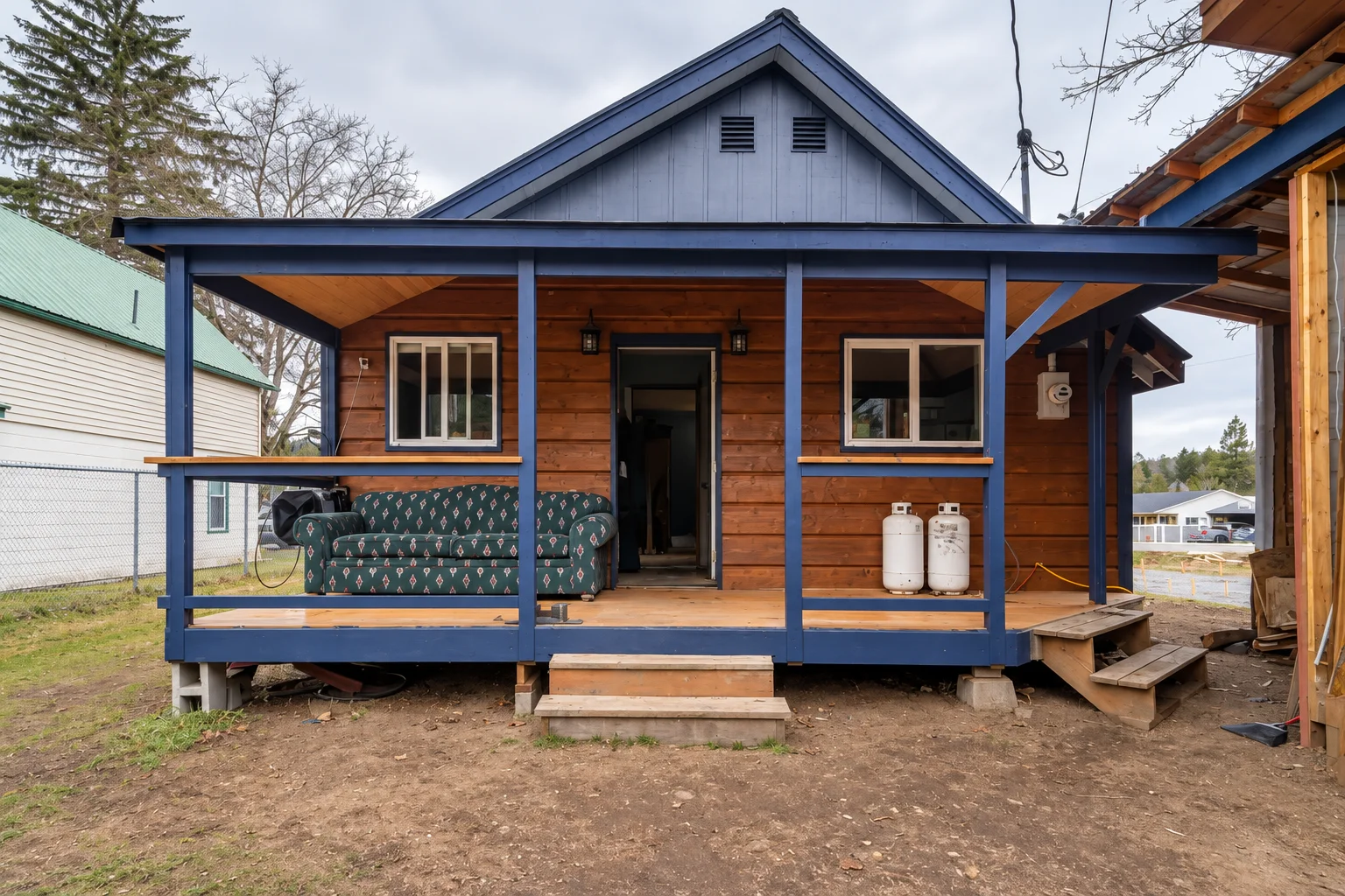 Finished covered porch with timber posts and railing